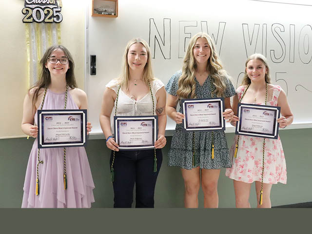 Four CiTi New Visions graduates standing with certificates
