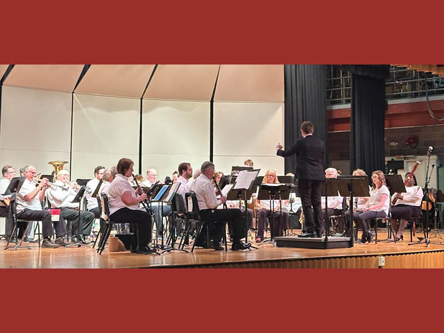 Fulton Community Band on stage at G Ray Bodley High School