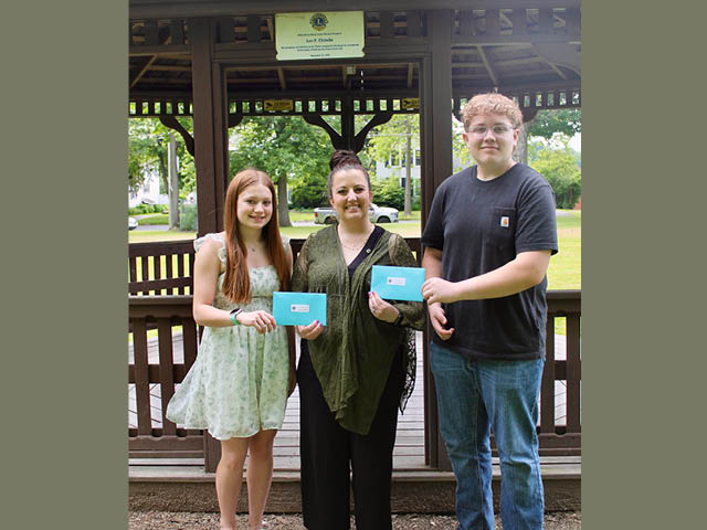 Ian Daniels and Karina Santana,(far left) both 2025 graduates of G. Ray Bodley High School, were awarded the Fulton Lions Club’s 2025 H. and Mary Dowd Memorial, and John Scaringi Memorial scholarships respectively, said Zach Merry, Fulton Lions past president and scholarship chair. Presenting the scholarships is Fulton Lions Club Vice President Melissa Champion.