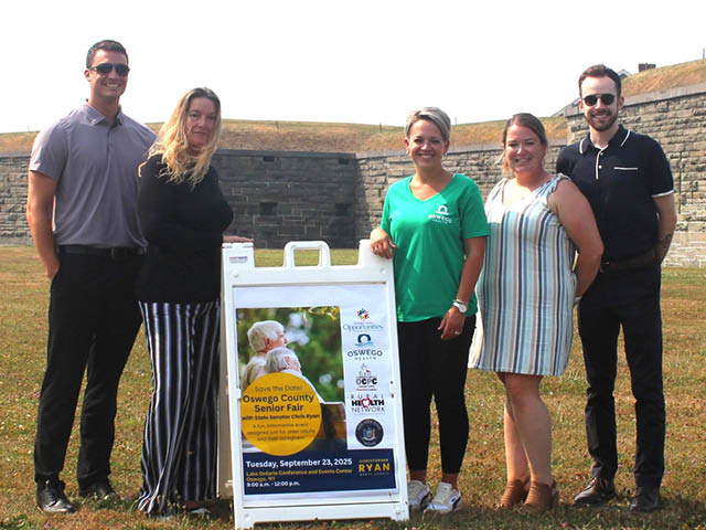 Pictured at Fort Ontario State Historic Site promoting the 2025 Oswego County Senior Fair from left are Dylan Lavner, Oswego County Prevention Coalition; Jennifer Rice, CenterWell Home Health; Jamie Leszczynski, Oswego Health; Joelle Hutson, Oswego County Opportunities; and Kyle McCauley, Oswego County Prevention Coalition. 