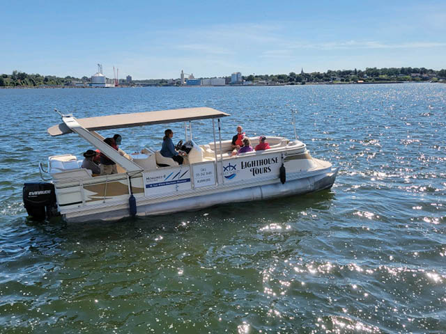 Oswego Lighthouse tour boat on the water