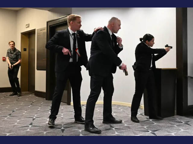 Secret Service agents with their weapons drawn during Saturday's White House Press Correspondents' Dinner