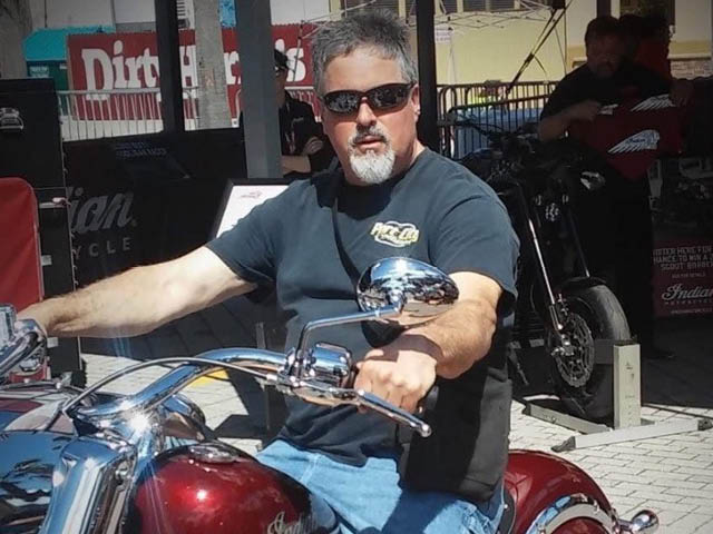 Waterbury on a motorcycle