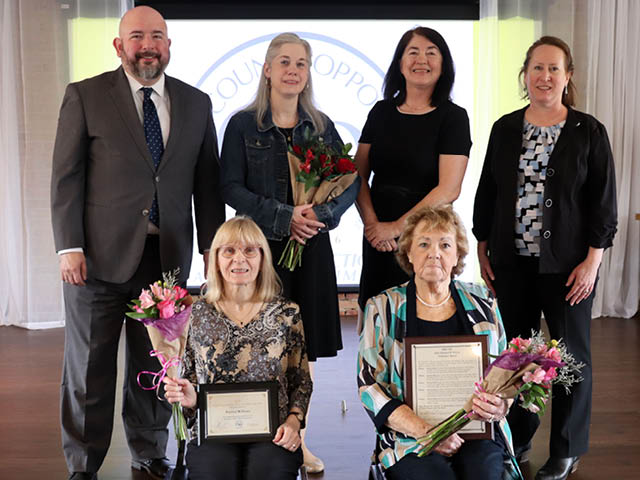Seated from left are Volunteers Patricia Williams and Beverly Kelley. Standing alongside Kevin Dean are Support Services Specialist Sarah Babcock, Manager of The Bistro, OCO’s Dining and Activity Center in Central Square Deirdre McCarthy, and OCO Board President Jill Lyon.
