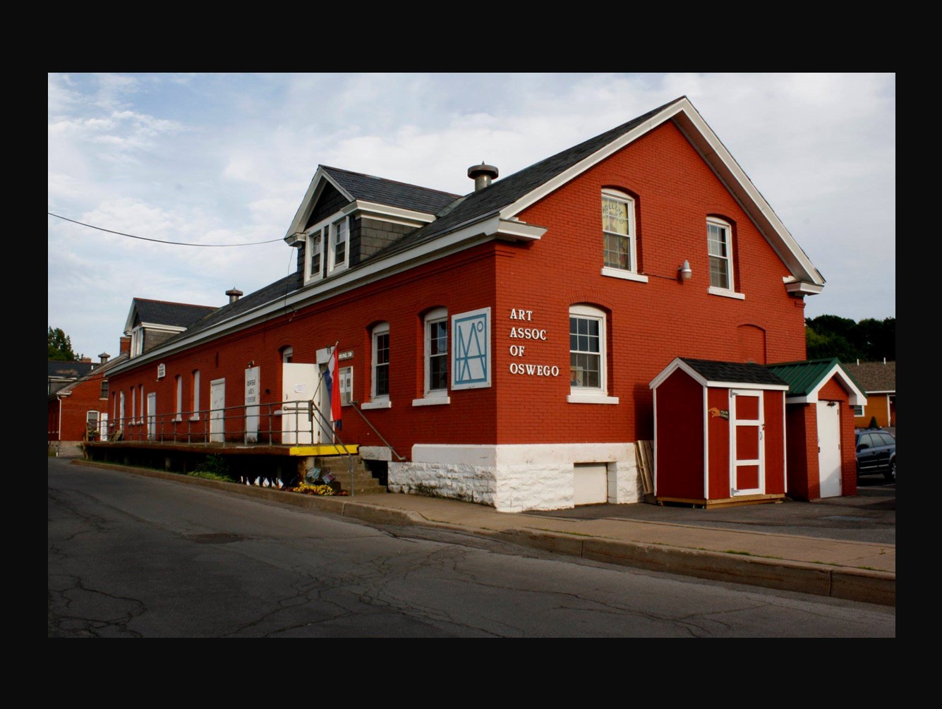 Red brick building with Art Assoc of Oswego printed on side