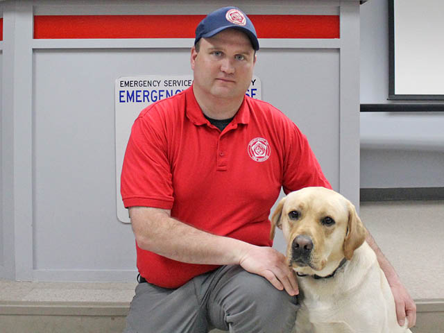 Shawn Simoneau and certified K9 Cedar
