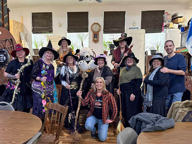The Lake Ontario Broom Riders meet with Salmon River Winter Festival organizer Shawn Doyle and event mascot Buddy the Bear at the Half-Shire Historical Society in Richland to prepare for this year’s event. 