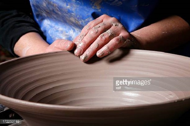 throwing on a pottery wheel class