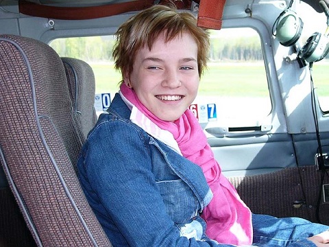 Young Eagles participant in the cockpit after her flight