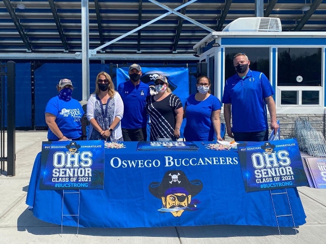 Buc Boosters Support  Oswego High School Seniors With Yard Signs