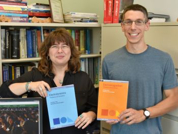 Textbook team -- SUNY Oswego physics faculty member Carolina Ilie and 2015 graduate Zachariah Schrecengost recently co-authored their second physics text together, &quot;Electrodynamics: Problems and Solutions.&quot; Julia D&#039;Rozario (not pictured), a 2016 SUNY Oswego graduate, provided illustrations for that book and its predecessor, &quot;Electromagnetism: Problems and Solutions.&quot;