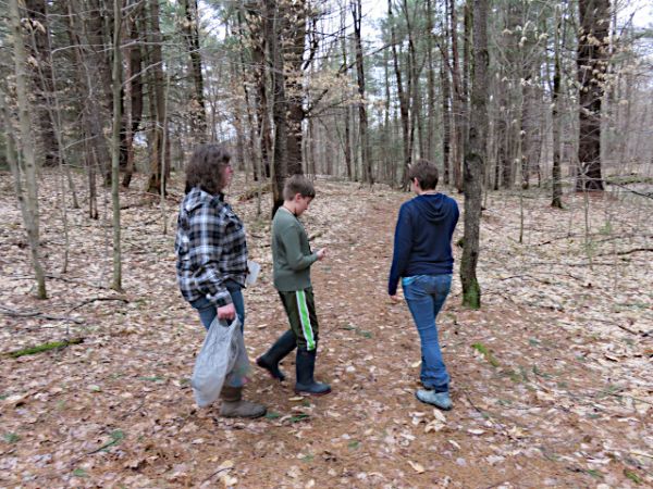 Participants in a previous year on the trail looking for their eggs using the GPS unit. 