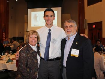  Passing along passion -- John and Sally Sodemann Sroka, successful 1966 SUNY Oswego graduates, pose with 2018 graduate Trevor Wilcox, recipient of the scholarship the Srokas established for a student with financial need who wishes to pursue a career in teaching. The couple also reached out to the college and its marketing faculty and students to explore ways to better recruit younger generations to become volunteer firefighters, a cause to which the Srokas are very devoted.